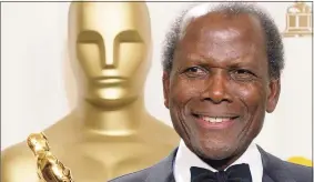  ?? Doug Mills / AP ?? Sidney Poitier poses with his honorary Oscar trophy during the 74th annual Academy Awards in Los Angeles on March 24, 2002.