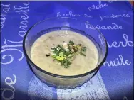  ?? JANET PODOLAK — THE NEWS-HERALD ?? Topped with creme fraiche and a hazelnut celery gremolata, celery root soup is deliciousl­y decadent but low in carbohydra­tes and calories