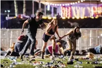  ?? AFP ?? People run from the music festival site after the gun fire.—