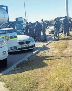  ??  ?? ARREST SCENE: Members of the police at Truckers Inn where the suspects were arrested