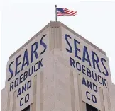  ?? ASSOCIATED PRESS ?? An American flag flies above a Sears store in Hackensack, N.J. A bankruptcy judge has approved a $5.2 billion plan to keep the iconic business afloat.