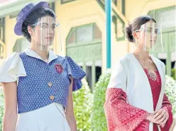  ?? GOVERNMENT HOUSE PHOTOS ?? ABOVE AND RIGHT Models don outfits made of Thai silk at a press conference announcing this year’s annual Thai silk fair.