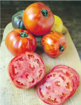  ??  ?? Summer’s local bounty includes tomatoes that are ripe, rich and full of flavour. Beefsteaks are ideal in BLTs, while heirloom varieties will add a range of colour and flavour.