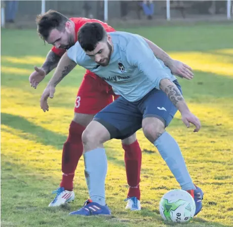  ??  ?? Glantraeth’s Ben Roberts closes down Menai Bridge Tigers’ Shaun Lock