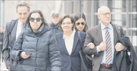  ?? Mary Altaffer / Associated Press ?? nancy Salzman, 64, center, leaves federal court Wednesday in Brooklyn. the co-founder of nxivm pleaded guilty in a case featuring claims that some followers became branded sex slaves. She faces 33 to 41 months in prison and a potential $250,000 fine at her July 10 sentencing. nxivm leader Keith raniere’s criminal trial will take place April 29 in Brooklyn.