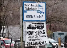  ?? NAM Y. HUH - THE ASSOCIATED PRESS ?? A sign seeking truck drivers at a business in Gary, Ind., on March 26. On Thursday, the Labor Department reported the number of people who applied for unemployme­nt benefits last week increased.