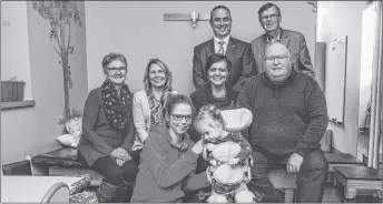  ?? SUBMITTED ?? Carla and Payton Moore (in front) are pictured with the team from Investors Group. From left are: Janice Thompson, Lisa Macdonald, Shelley MacKinnon and Mike McKean. In back are Craig Mercer and Gerald McGuire.