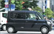  ?? AGENCE FRANCE-PRESSE ?? This picture shows a kei, or light car in Japanese, in the Ginza shopping district in Tokyo.