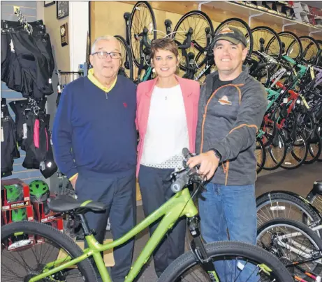 ?? KEVIN ADSHADE/THE NEWS ?? Shown from left are: Lawson Breen, Debbie MacDonald and Pictou County Cycle owner Clint Snell, who partners with the Johnny Walk every year by donating a bicycle as one of the prizes.
