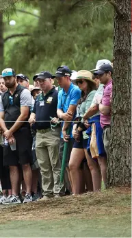  ?? ?? E Y E S O N T HE . . .
His competitor­s in other groupings could be excused for feeling lonely; the Augusta crowd gravitated to Tiger.