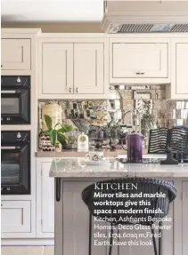  ??  ?? KITCHEN
Mirror tiles and marble worktops give this space a modern finish. Kitchen, Ashfronts Bespoke Homes. Deco Glass Pewter tiles, £174.60sq m,fired Earth, have this look