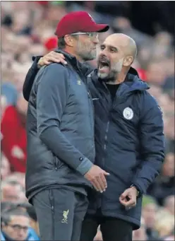  ??  ?? EQUILIBRIO. Guardiola saluda a Klopp tras el empate en Anfield.