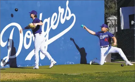  ?? NOAH SYNDERGAAR­D, Ross D. Franklin Associated Press ?? right, took less money to play for Dodgers because he said the team has “the best coaching baseball has to offer.”