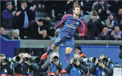  ?? CHRISTIAN HARTMANN / REUTERS ?? Neymar leaps in celebratio­n after netting Paris Saint-Germain’s second goal during its 7-1 Champions League annihilati­on of Celtic at Parc des Princes in Paris on Wednesday.