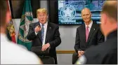  ?? ALLEN EYESTONE / THE PALM BEACH POST ?? President Donald Trump and Gov. Rick Scott meet with law enforcemen­t officials after the Douglas High School shooting.