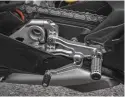  ??  ?? RIGHT: Billet aluminium foot-pegs with carbon heal plate and articulate­d brake and shift pedals to minimize the risk of breaking in the event of a slide. The gear selector can be quickly reversed to race shift