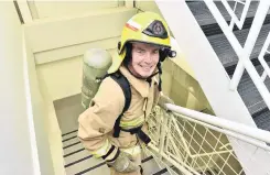  ?? PHOTO: GREGOR RICHARDSON ?? Feeling the burn . . . Practising for the Firefighte­r SkyTower Stair Challenge at the University of Otago Business School is Brighton firefighte­r Brian Freeman.