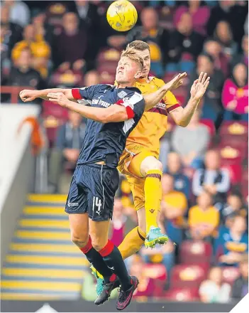  ??  ?? Dundee’s Mark O’Hara (left) with Stephen McManus.