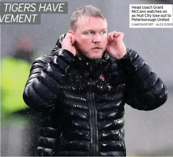  ?? CAMERASPOR­T - ALEX DODD ?? Head coach Grant Mccann watches on as Hull City lose out to Peterborou­gh United