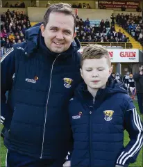 ??  ?? Davy Fitzgerald with Michael O’Brien, a new friend he made at the Late Late Show, before the hurlers’ victory on Sunday.