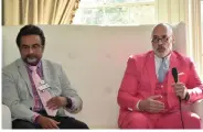  ?? (Pine Bluff Commercial/I.C. Murrell) ?? Dr. Asif Masood and Dr. Joseph Browning of Jefferson Regional Medical Center speak on stage at the Pretty in Pink luncheon.