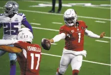  ?? Michael Ainsworth / Associated Press ?? The Cowboys’ Xavier Woods defends as the Cardinals’ Andy Isabella ( 17) helps Kyler Murray score in the second half.