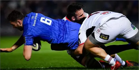  ??  ?? Leinster flanker Josh Murphy from Enniscorth­y is tackled by Ulster’s Greg Jones during the PRO14 game atthe RDS Arena on Saturday.