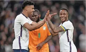  ?? Picture: Mike Hewitt/Getty ?? Raheem Sterling, right, celebrates his goal for England last night with fellow scorer Ollie Watkins