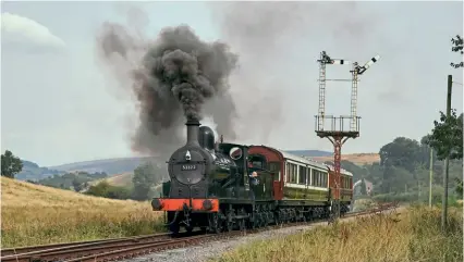  ?? WILL SMITH ?? The Embsay & Bolton Abbey Steam Railway is planning to install solar panels on non-heritage buildings. On September 3/4, the line celebrated the centenary of the Lancashire & Yorkshire Railway merging with the London & North Western Railway. Andy Booth’s L&Y ‘A’ 0-6-0 No. 52322 is pictured hauling a pair of the vintage carriages resident on the line – LNWR Director’s Saloon No. 5318 and L&Y Directors’ Saloon No. 1.