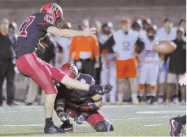  ?? HERALD FILE PHOTO BY JOSEPH PREZIOSO ?? SOMETHING’S AFOOT: Harvard kicker Jake McIntyre (47) kicked four field goals in Friday night’s win against Holy Cross.