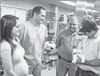  ??  ?? NOW YOU ‘SEA’ ME: Puerto Rico Gov. Ricardo Rosselló holds baby Sara Victoria Llull Rodriguiz alongside her family.