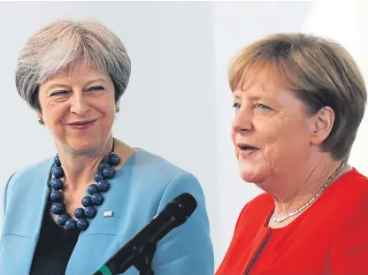  ?? Picture: AP. ?? Prime Minister Theresa May, left, and German Chancellor Angela Merkel prior to a meeting in the chanceller­y in Berlin, Germany.