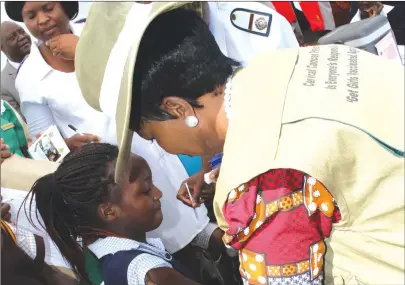  ?? Picture: Tinai Nyadzayo ?? The First Lady Amai Auxillia Mnangagwa helps to vaccinates 11-year-old Tadiwa Mupedziswa of Bearing Primary School during the launch of the National HPV vaccinatio­n programme that was held at Chancellor Primary School in Manicaland on Wednesday.—