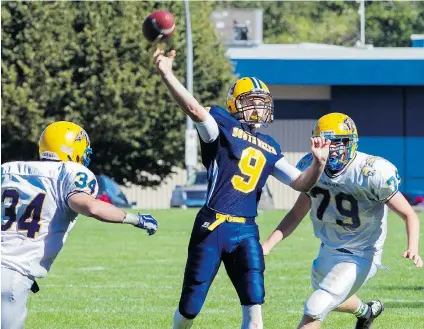  ?? JENELLE SCHNEIDER/ PNG ?? South Delta Sun Devils quarterbac­k Lucas Kirk fires a pass despite the rush of Handsworth Royals defenders Matt Anderson, left, and Ian Vanagas during action earlier this year. Kirk’s Sun Devils will face Mt. Douglas in Saturday’s Senior Triple- A final.