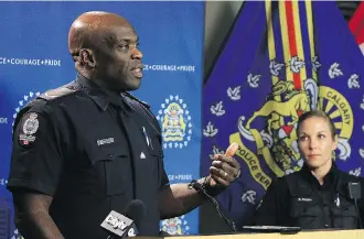  ?? DEAN PILLING ?? Const. Ray Wilson of the Edmonton Police Service speaks at a press conference on retail crime in Alberta while Const. Kara Hagen of the Lethbridge Police Service looks on. Calgary Police have joined forces with the surroundin­g Alberta communitie­s of Lethbridge, Edmonton and Airdrie to fight retail crime.