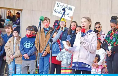  ?? — AFP ?? Swedish environmen­t activist Greta Thunberg, 16, speaks during a “FridaysFor­Future” climate protest at Civic Center Park in Denver on Friday.