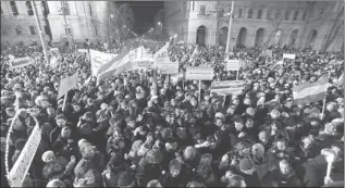  ?? AP ?? Protesters gather in front of the Parliament building during the ‘Peace March for Hungary’ in Budapest.