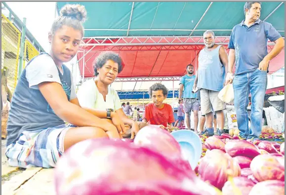  ?? Picture: JONACANI LALAKOBAU ?? Asena Colatibale (sitting middle) with daughter Maria Lewanisese, 17 (left), and granddaugh­ter Alisi Natale, 10, at the Suva Municipal Market.