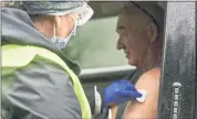  ?? KRISTOPHER RADDER — THE BRATTLEBOR­O REFORMER VIA AP, FILE ?? Registered nurse Megan Chamberlai­n gives a flu shot to Anthony Devitt, of Marlboro, Vt., during a flu vaccine clinic on Route 9 in Brattlebor­o, Vt.