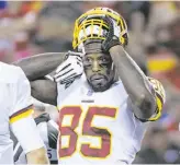  ?? Reed Hoffmann / Associated Press ?? Former 49ers head coach Jim Tomsula, left, is sporting a new look with Washington as its defensive line coach. Tight end Vernon Davis has rejuvenate­d his career in Washington.