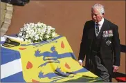  ?? HANNAH MCKAY / POOL VIA AP ?? Prince Charles follows the coffin of his father, Britain’s Prince Philip, during the funeral on Saturday. Prince Philip died April 9 at the age of 99 after 73 years of marriage to Britain’s Queen Elizabeth II.