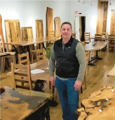  ?? RYAN KNELLER/THE MORNING CALL ?? Trading Post Depot owner Ed DiLello poses in his newly opened downtown Easton showroom. The business offers a variety of hand-crafted wooden furniture.