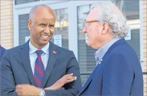  ?? STU NEATBY/THE GUARDIAN ?? Federal Immigratio­n Minister Ahmed Hussen chats with P.E.I. Premier Wade MacLauchla­n during a meeting of the Atlantic Growth Strategy in Summerside on Tuesday.