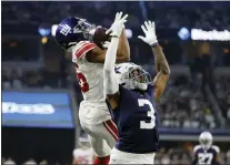  ?? MICHAEL AINSWORTH — THE ASSOCIATED PRESS ?? Giants wide receiver Darius Slayton, left, catches a pass for a first down as Dallas Cowboys cornerback Anthony Brown (3) defends in Thursday’s game in Arlington, Texas.