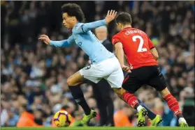  ?? (AP Photo/Rui Vieira) ?? Manchester City's Leroy Sane (left) duels for the ball with Southampto­n's Cedric Soares during the English Premier League soccer match between Manchester City and Southampto­n at Etihad stadium in Manchester, England, Sunday, Nov. 4, 2018.