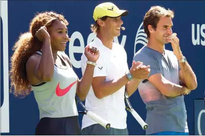  ?? CHARLES SYKES . INVASION VIA AP FILE ?? In this Aug. 24, 2013, file photo, tennis players, from left, Serena Williams, Rafael Nadal and Roger Federer cheer on the competitio­n at the 18th annual Arthur Ashe Kids’ Day, the kickoff to the 2013 U.S. Open tennis tournament, in New York. The last time a Grand Slam tennis tournament was played without Williams, Federer and Nadal was in 1997. The U.S. Open will start next week without any of that trio after Williams, 39, withdrew on Wednesday, joining Federer, 40, and Nadal, 35, on the sideline because of injury.