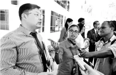  ??  ?? Dr Wong (left) fields questions from reporters on the rabies scare.