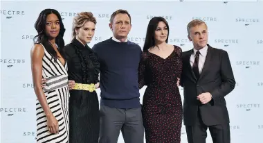  ?? BEN STANSALL/ AFP/ GETTY IMAGES ?? The 24th James Bond film Spectre will feature a truly internatio­nal cast. From left are Naomi Harris ( Britain), Lea Seydoux ( France), Daniel Craig as James Bond ( Britain), Monica Bellucci ( Italy) and Christoph Walz ( Austria).