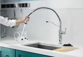  ?? BPT ?? The Tournant faucet by Kohler features a three-function, pull-down spray head, with a special BerrySoft setting, gentle enough for washing fruits and vegetables.