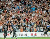  ?? PHOTOSPORT ?? Fans in the crowd during the T20 match between the Black Caps and Australia at Eden Park last Friday.